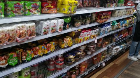 A grocery aisle filled with nothing but instant noodles.